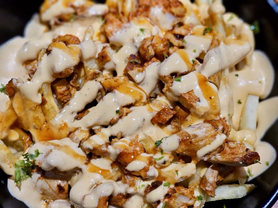 Fries loaded with chicken and sauce